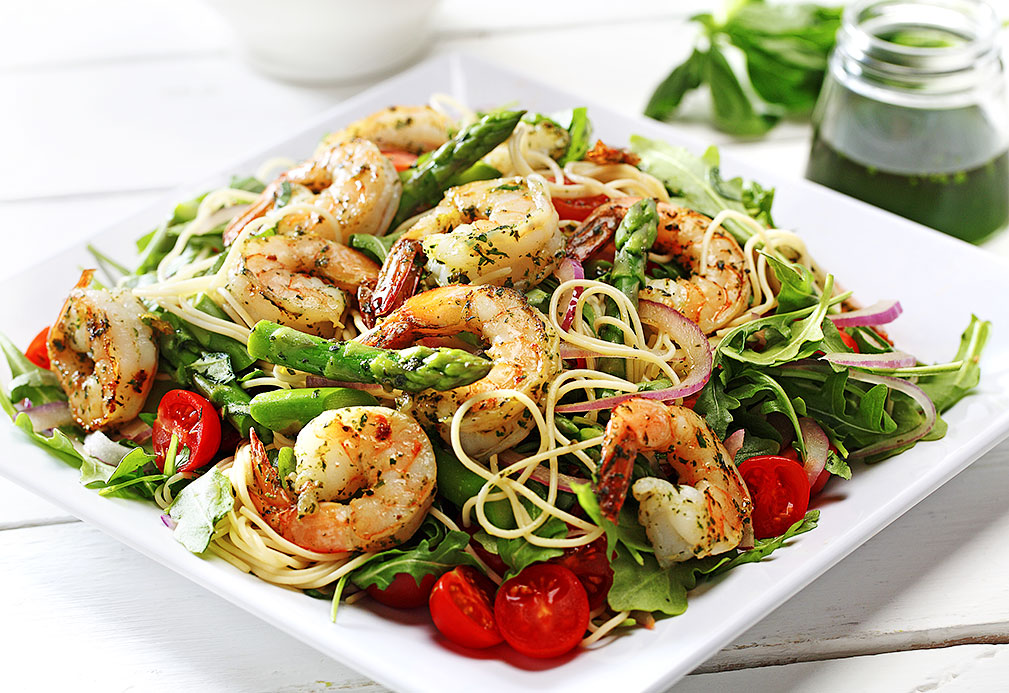 Lemon Basil Canola Oil Over Grilled Prawns And Pasta